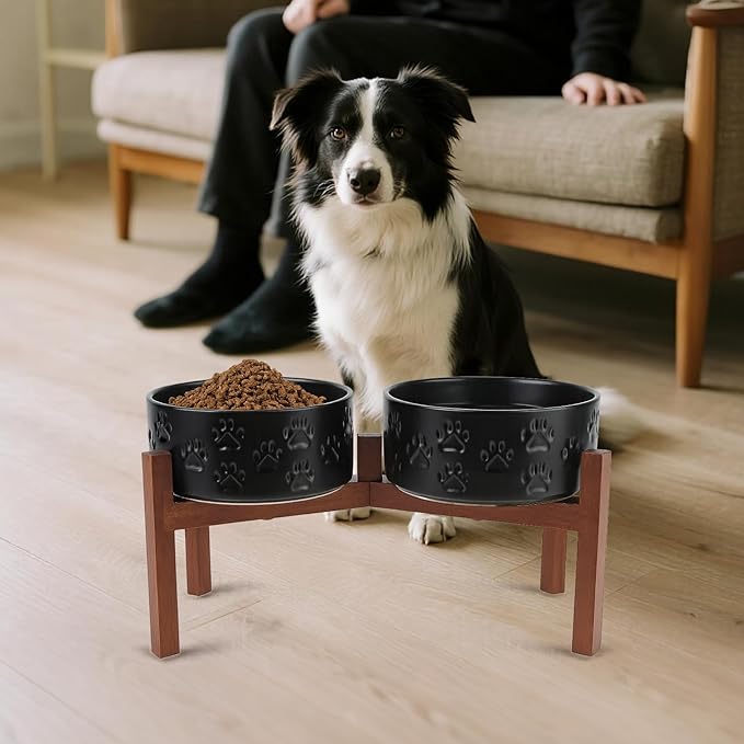 SPUNKYJUNKY Ceramic Elevated Dog Bowl Set with Acacia Wood Stand for Food and Water for Medium Dogs (42.27 OZ, Black, Dog Paw Pattern)