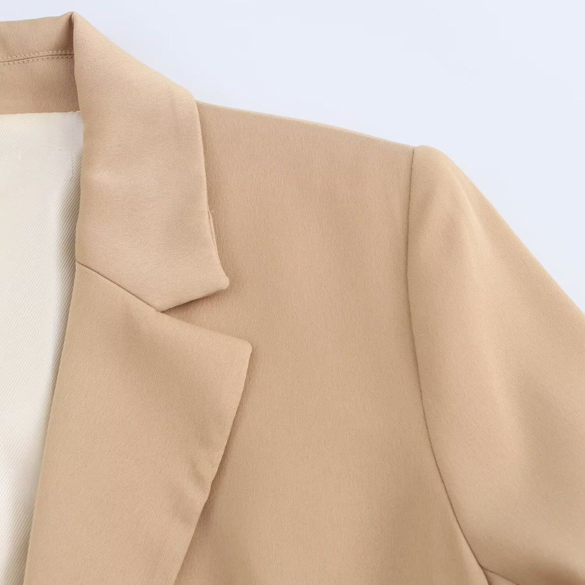 The Casual Long-sleeve Blazer Is Made From A Silk-like Satin Fabric