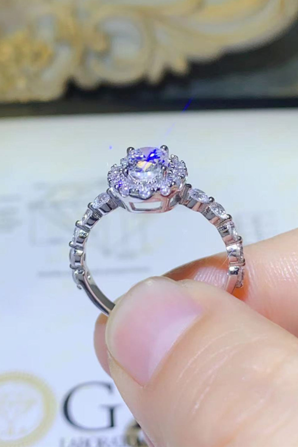 Adored 1 Carat Oval-Cut Sparkala™ Platinum Over Pure Sterling Silver Halo Ring