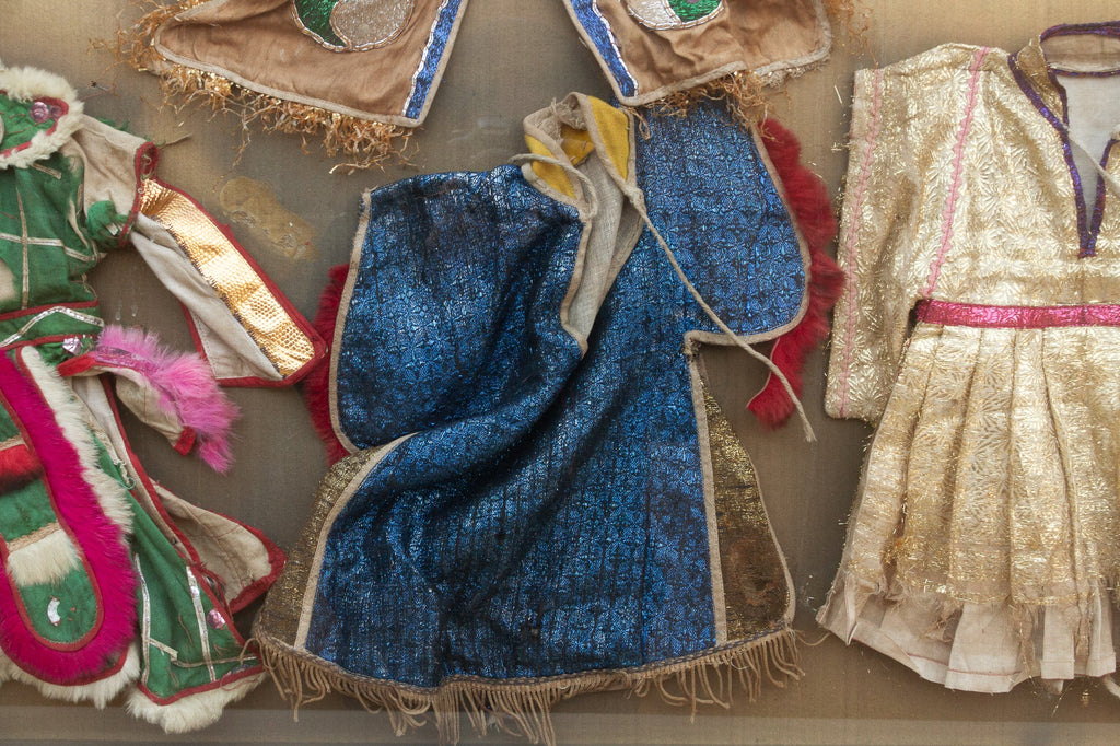 Framed Collection of Antique Children's Robes
